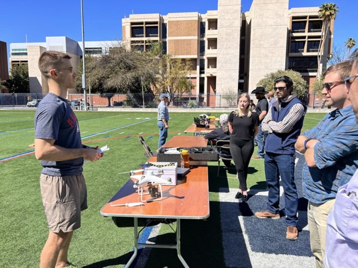 Truman Combs tells the audience about his drone before flying